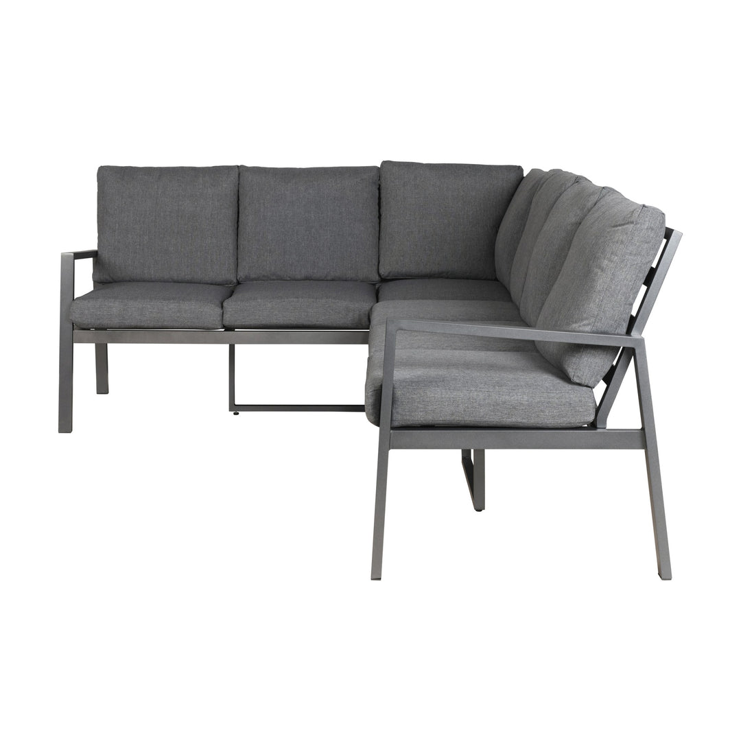 Manchester hjørnesofa i grå med aluminiumsramme, sett forfra med løse puter