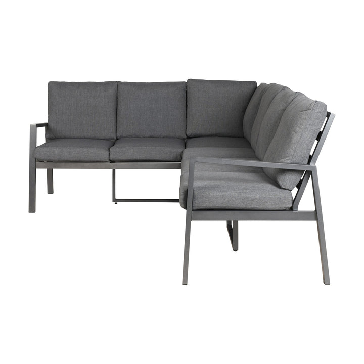 Manchester hjørnesofa i grå med aluminiumsramme, sett forfra med løse puter