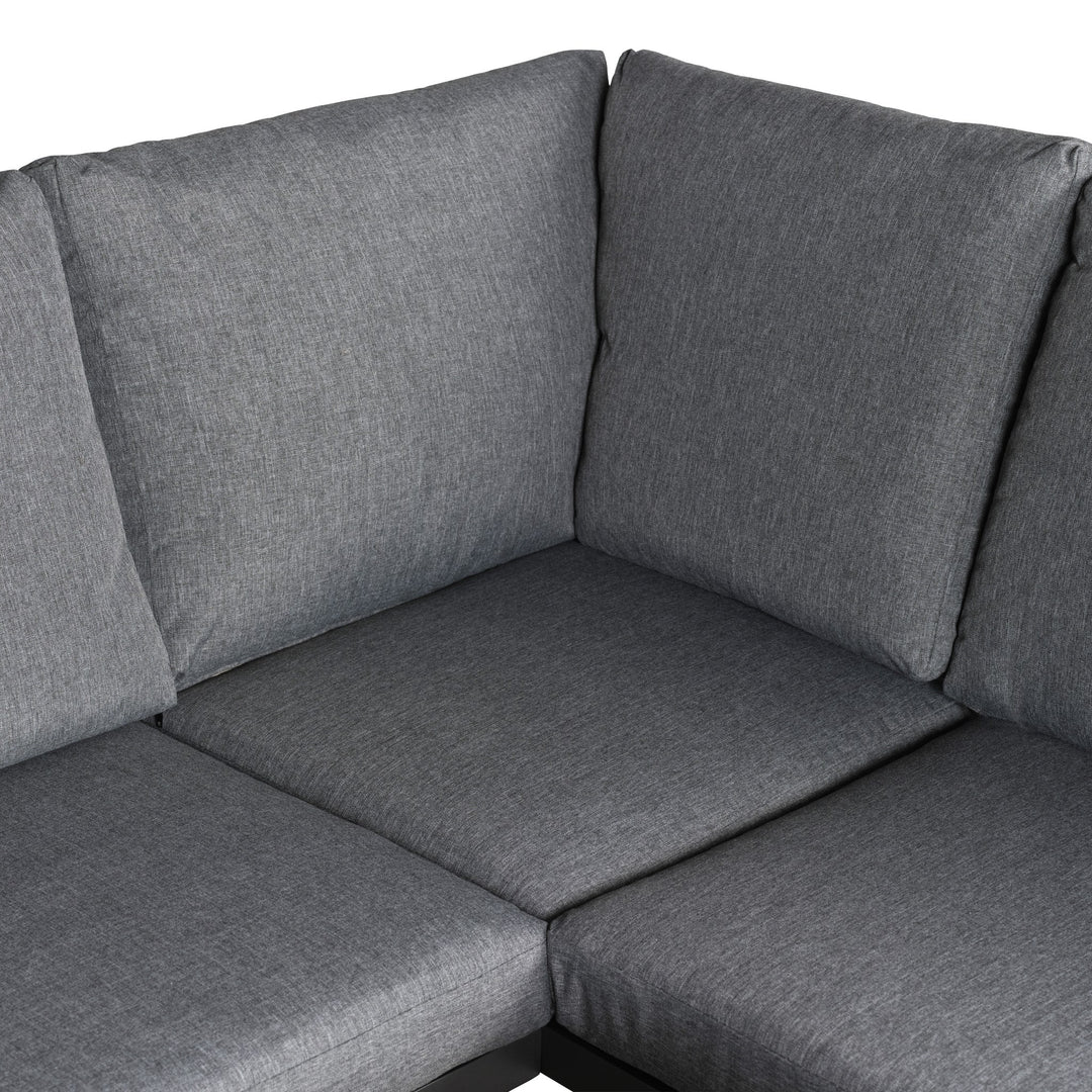 Manchester hjørnesofa i grå med aluminiumsramme, sett bakfra med åpen ryggkonstruksjon