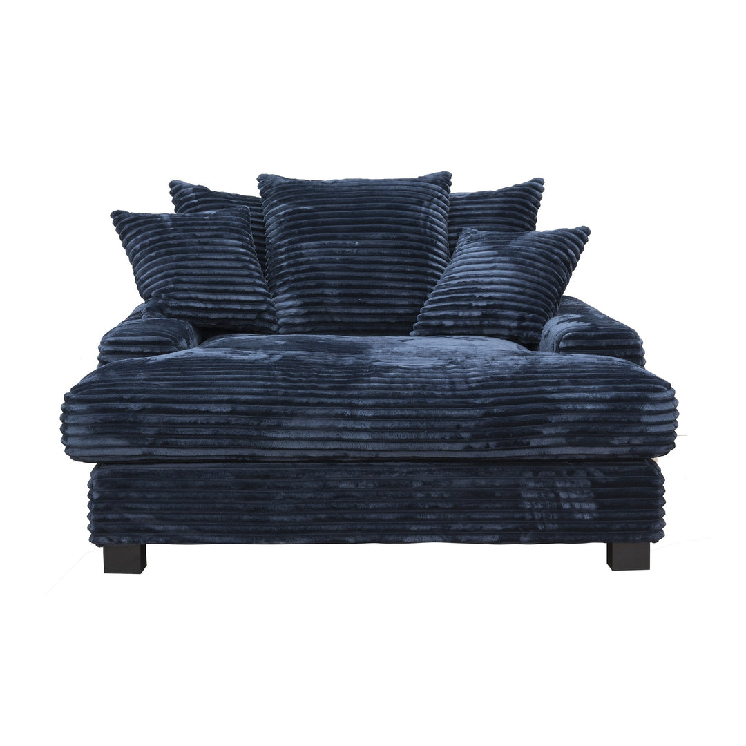 Tuva Xdeep daybed i mørk blå kordfløyel med løse puter, sett forfra mot hvit bakgrunn.