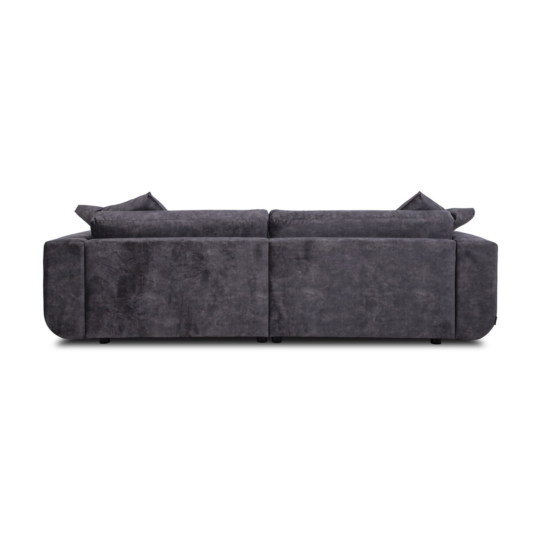 Motive sofa i koksgrå velur, sett bakfra med løse ryggputer