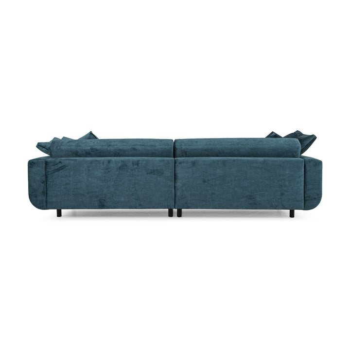 Lazy 3,5-seter sofa i petroleumsblå velur, sett bakfra med løse ryggputer