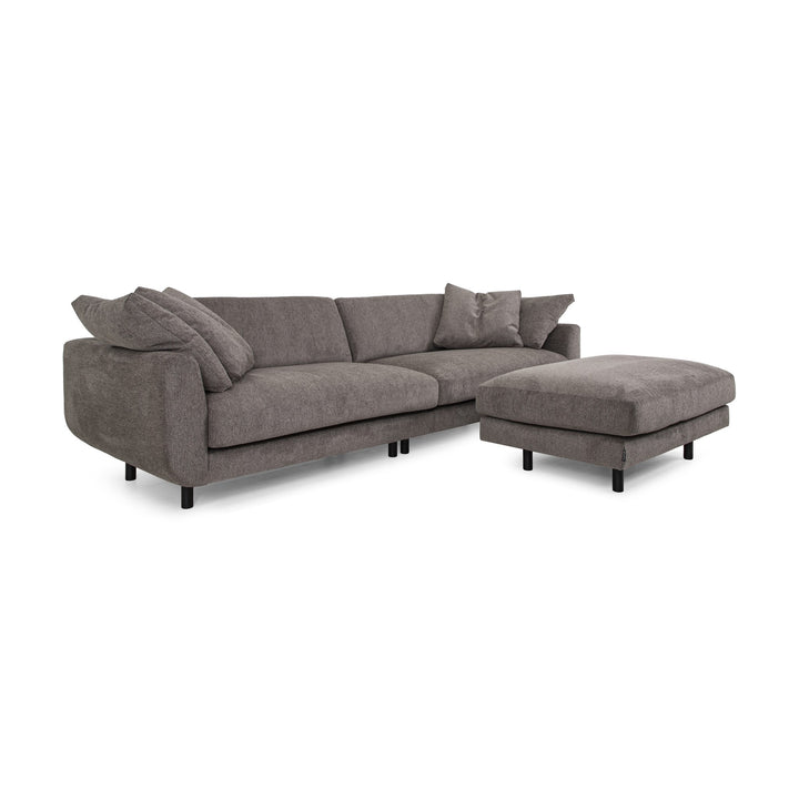 Lazy Sofa i gråbrun stoff sett fra siden, med løse puter og svarte ben