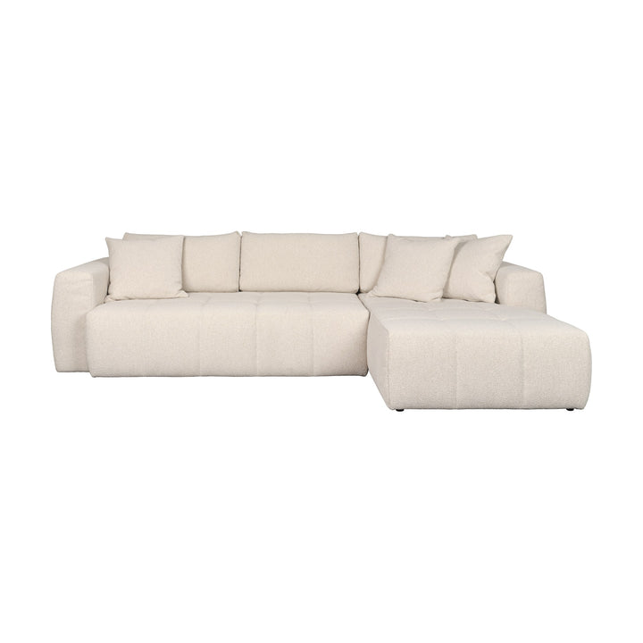 Hovden Fantasy sovesofa i beige bouclé med sjeselong og pynteputer, sett forfra.