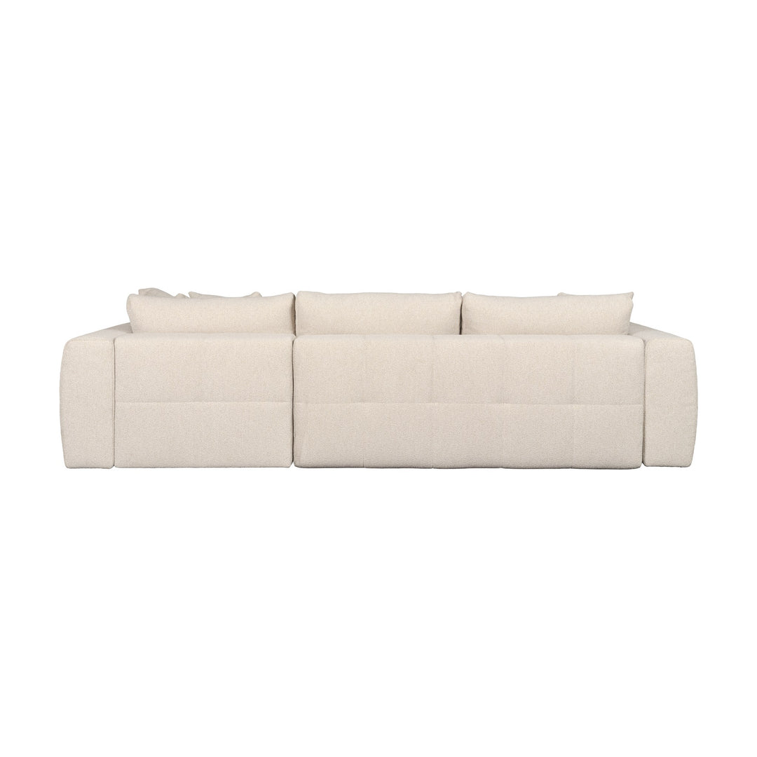 Hovden Fantasy sovesofa i beige bouclé med sjeselong, sett fra siden.