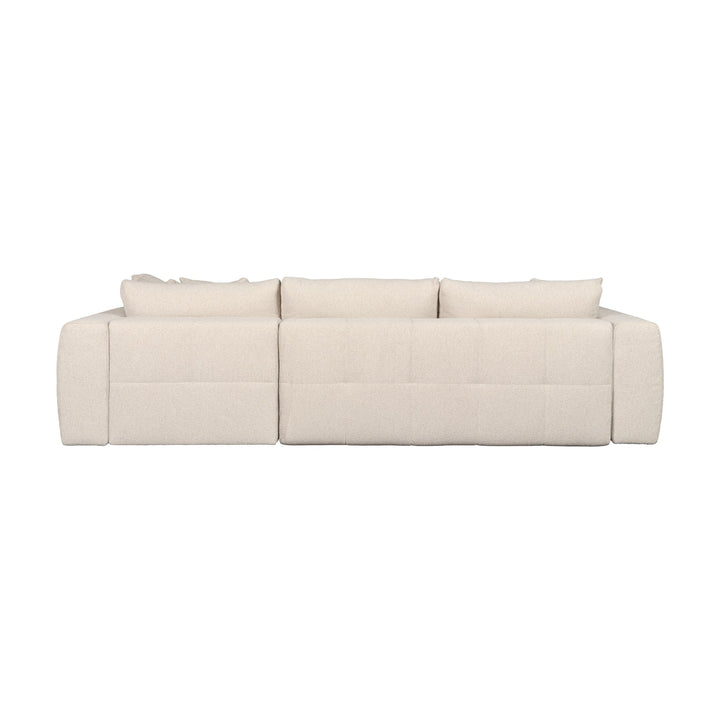 Hovden Fantasy sovesofa i beige bouclé med sjeselong, sett fra siden.