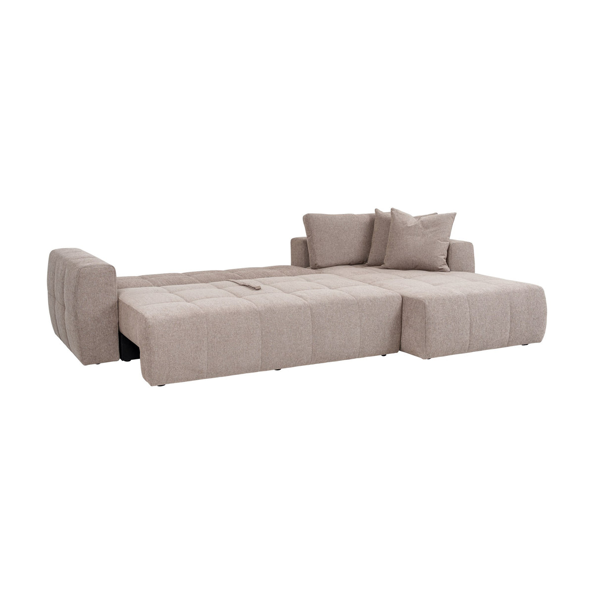 Hovden Fantasy sovesofa i gråbeige, oppredd som seng med puter, sett fra siden.