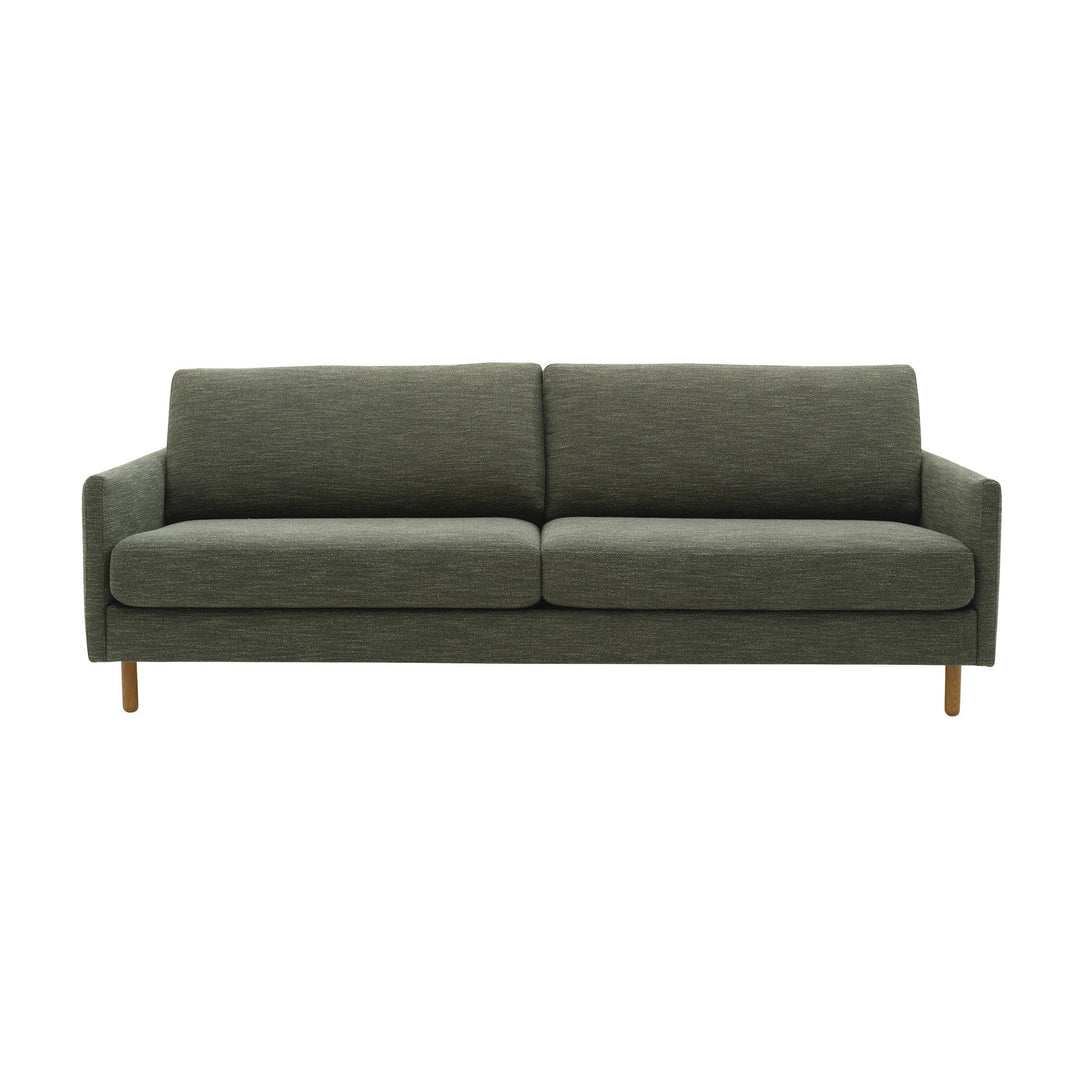 Scandinavian Touch sofa 4-seter i grønn med brede seteputer og runde treben