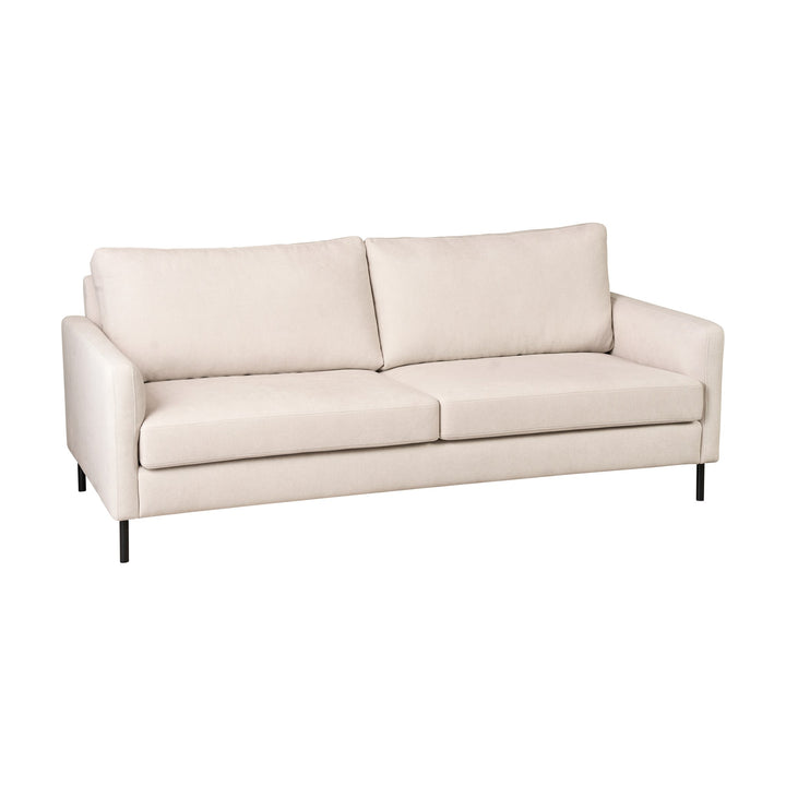 Hovden Como 3-seter sofa i kremhvit stoff med sorte metallben, sett forfra mot hvit bakgrunn