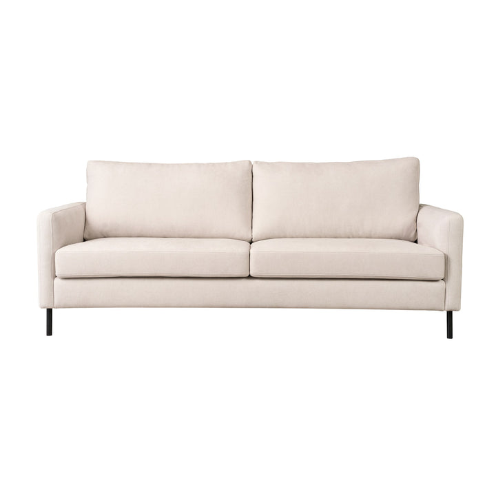 Hovden Como 3-seter sofa i kremhvit stoff med sorte metallben, rett forfra mot hvit bakgrunn