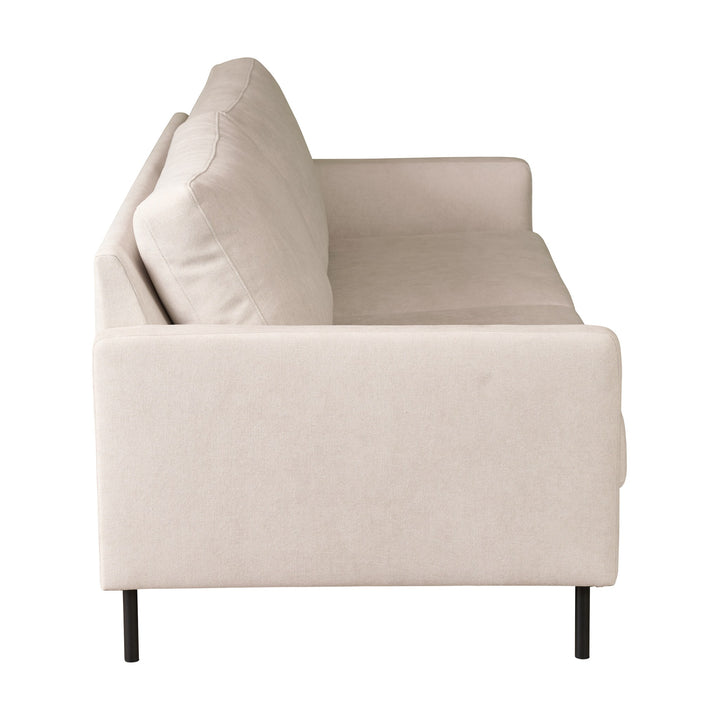 Hovden Como 3-seter sofa i kremhvit stoff med sorte metallben, sett fra siden mot hvit bakgrunn