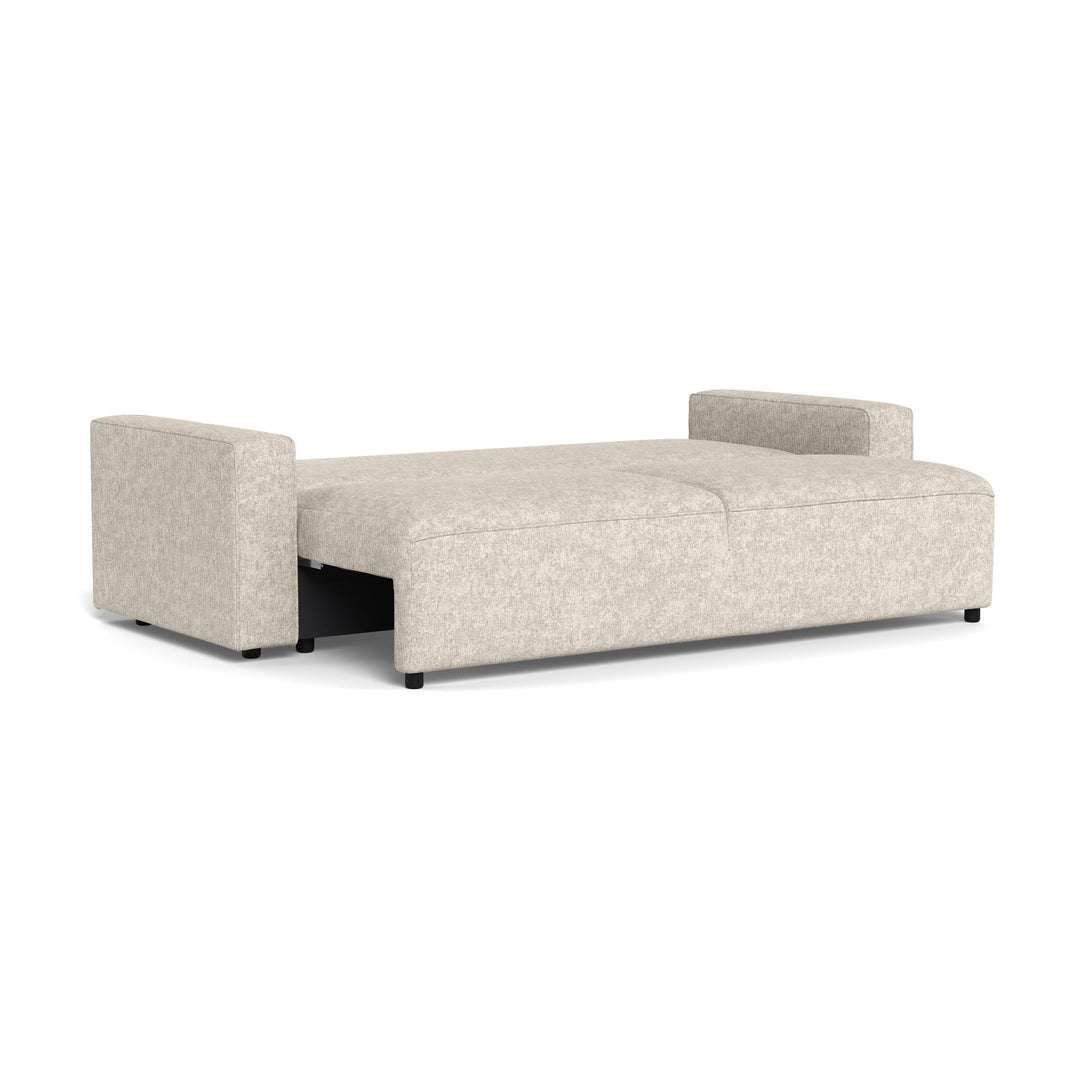 Vento sovesofa i beige chenille trukket helt ut til seng, sett skrått