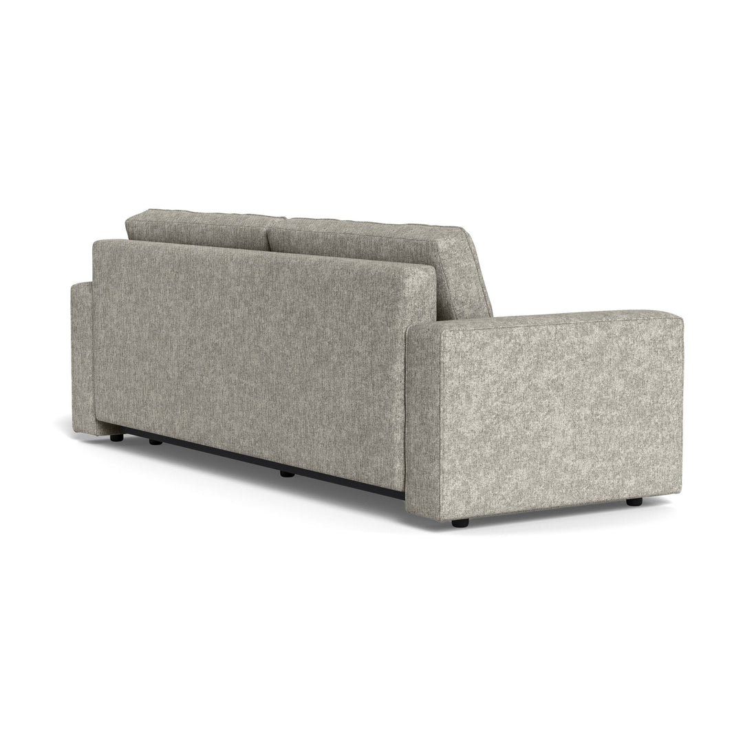 Vento sovesofa i lys grå chenille, sett skrått bakfra mot hvit bakgrunn