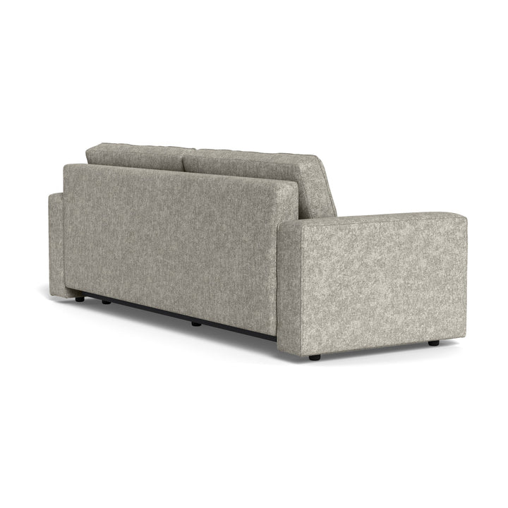 Vento sovesofa i lys grå chenille, sett skrått bakfra mot hvit bakgrunn