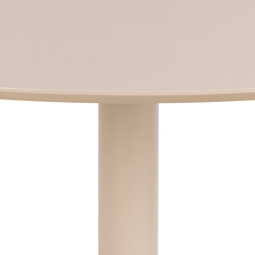 Ibiza spisebord i beige, nærbilde av den runde platen og den sylindriske søylefoten.