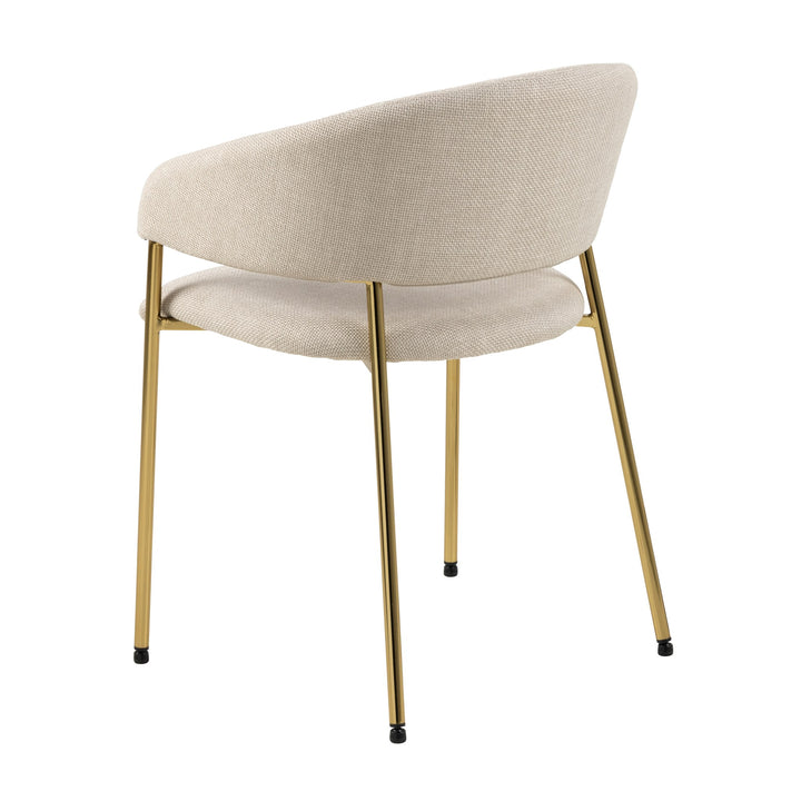 Ann spisestol i beige med gullben, sett skrått bakfra mot hvit bakgrunn