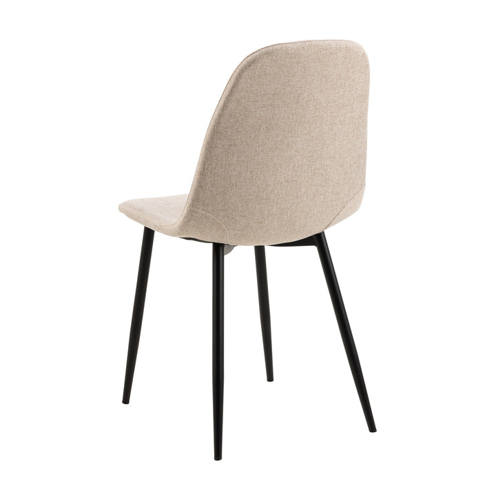 Celia spisestol i beige stoff med sorte metallben, sett skrått bakfra