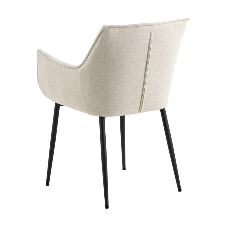 Bonita spisestol i lys beige med armlener og sorte metallben, sett skrått bakfra mot hvit bakgrunn
