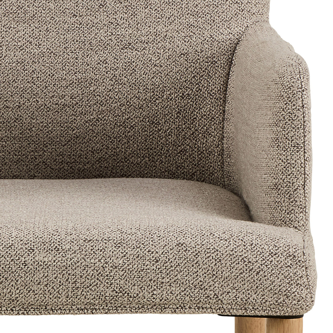 Zoe spisestol, nærbilde av beige bouclé-sete og rygg