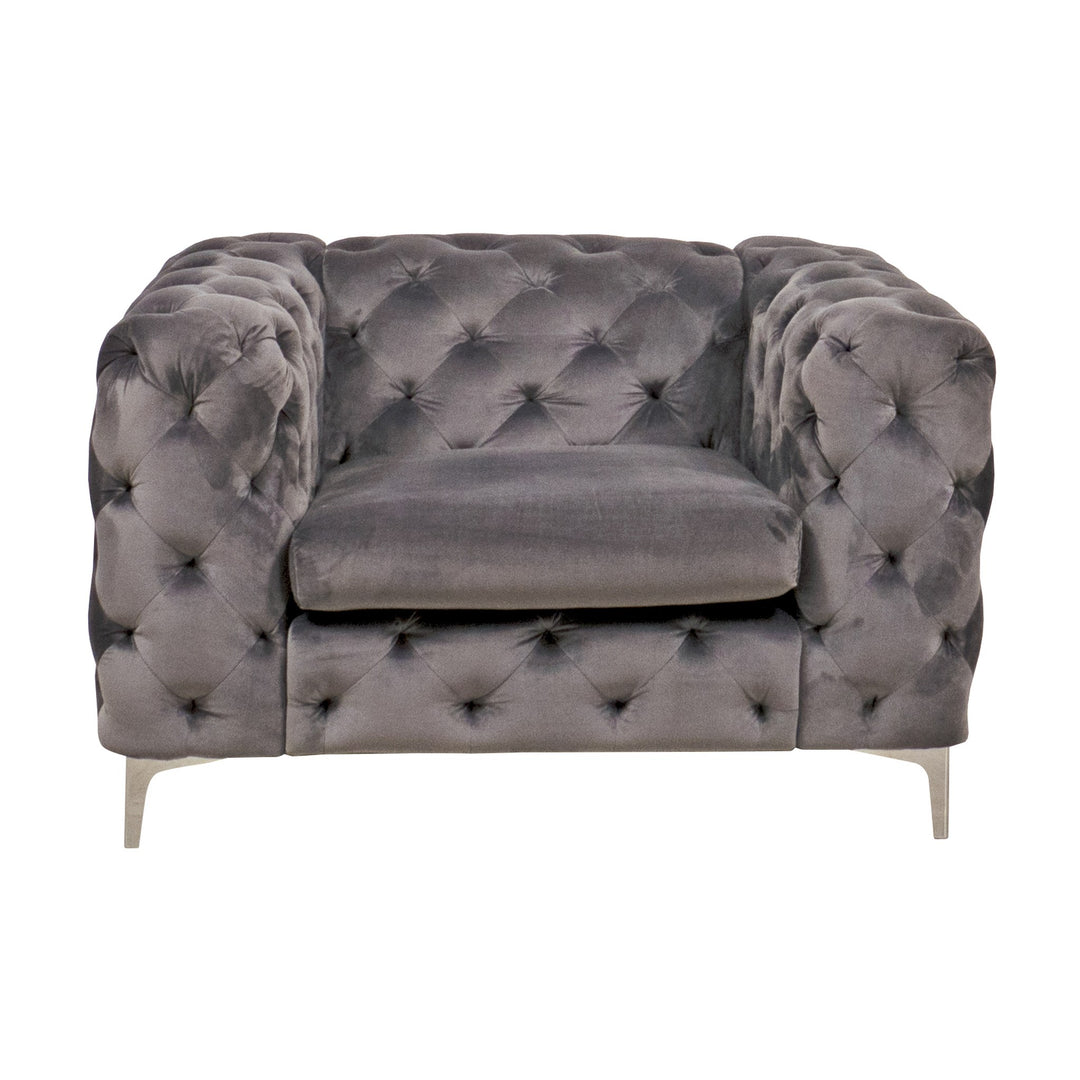 Bella sofa i grå velur, dyptuftet chesterfield-lenestol med blanke metallben