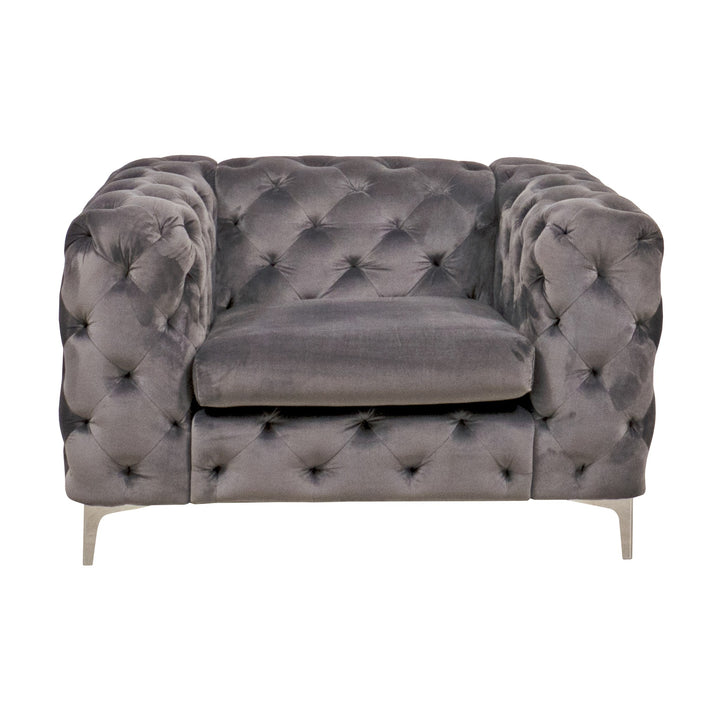 Bella sofa i grå velur, dyptuftet chesterfield-lenestol med blanke metallben