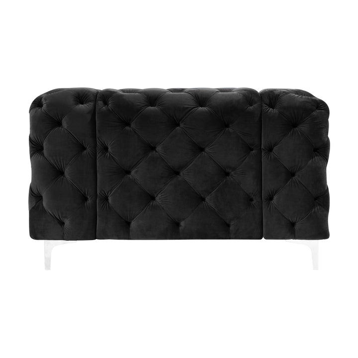 Bella sofa i sort tuftet velur med blanke akrylben, sett forfra mot hvit bakgrunn.