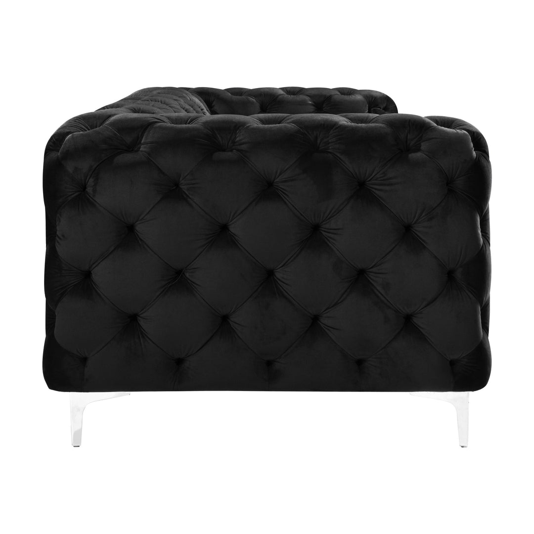 Bella sofa i sort velur, toseter med tuftet rygg og krombein, sett fra siden