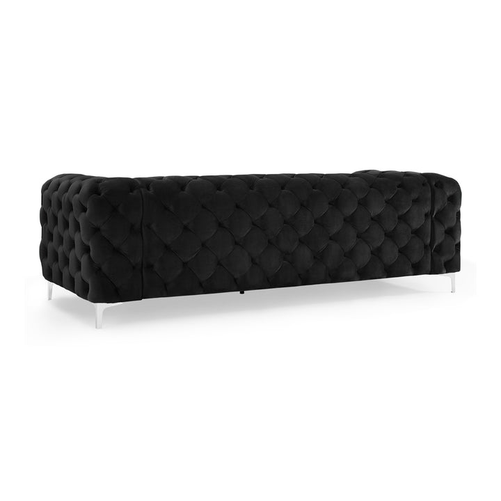 Bella sofa i sort velur, treseter med gjennomtuftet rygg og krombein, sett skrått bakfra