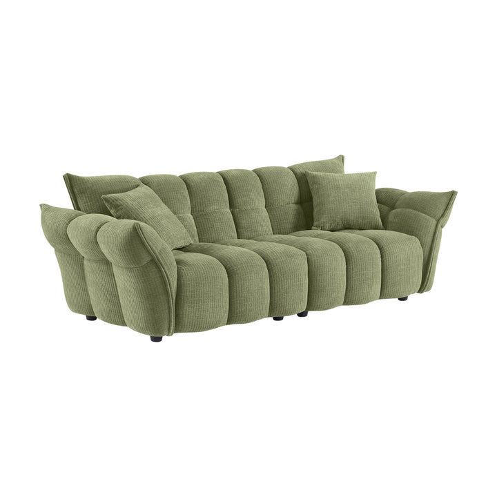Marigold sofa i grønn kordfløyel, skråvisning av pløset treseter med løse puter