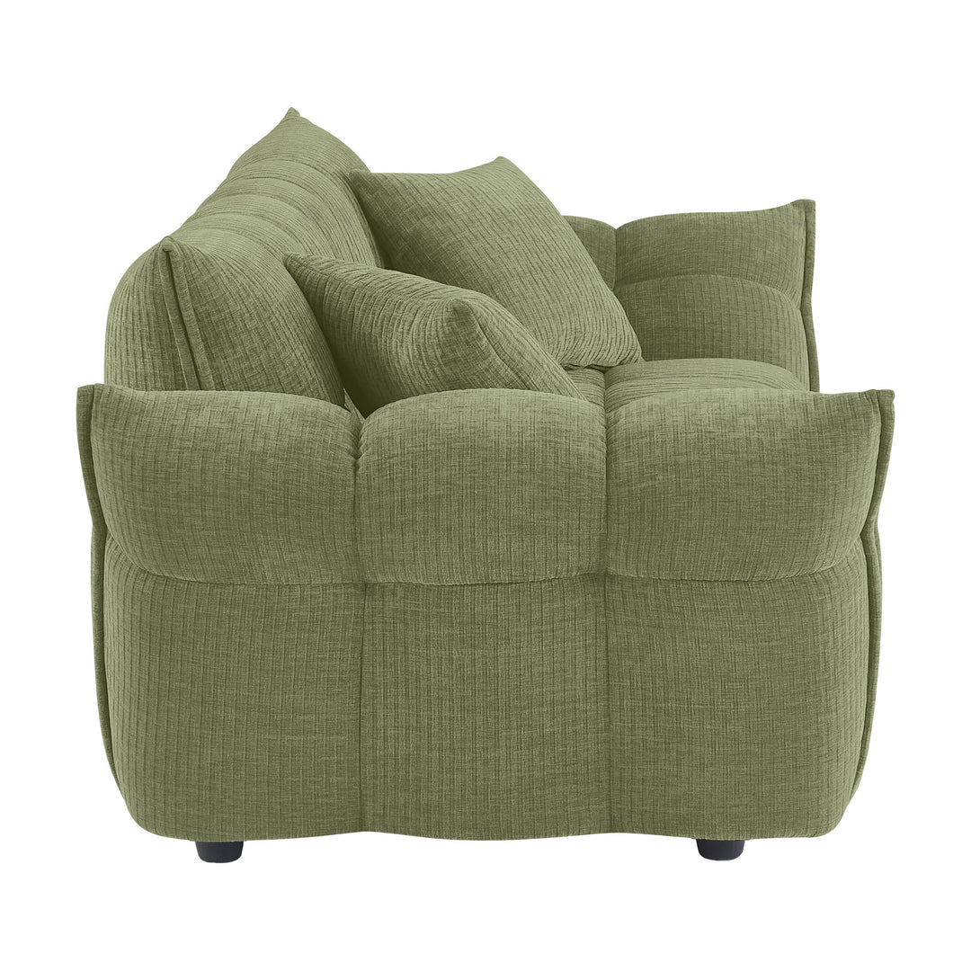 Marigold sofa i grønn kordfløyel, sidevisning av pløset rygg og rullet armlene