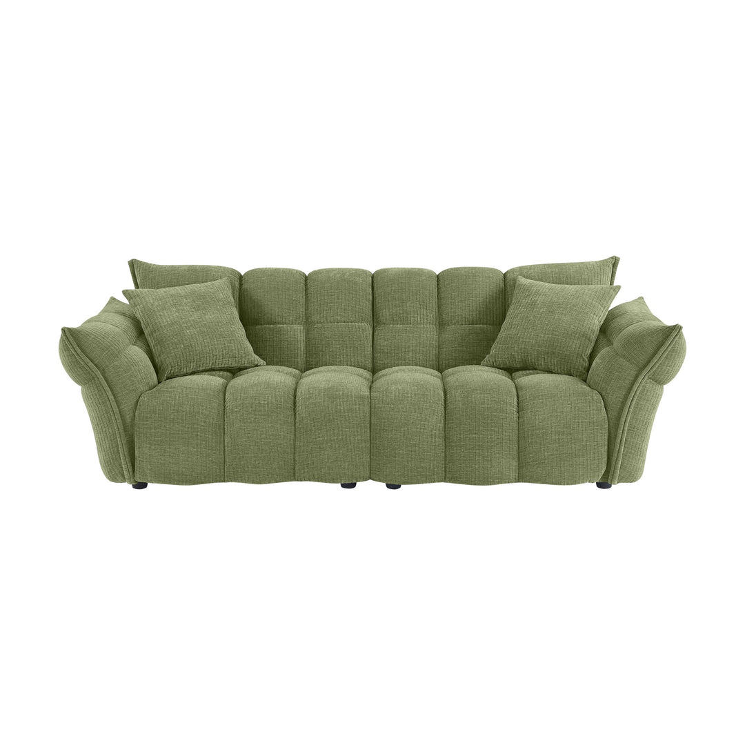 Marigold sofa i grønn med puffet, ribbet chenillestoff og mørke ben