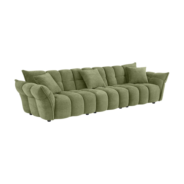 Marigold sofa i grønn kordfløyel, skråvisning av lang firseter med løse puter