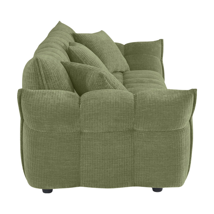 Marigold sofa i grønn kordfløyel, sidevisning av pløset rygg med høye armlener