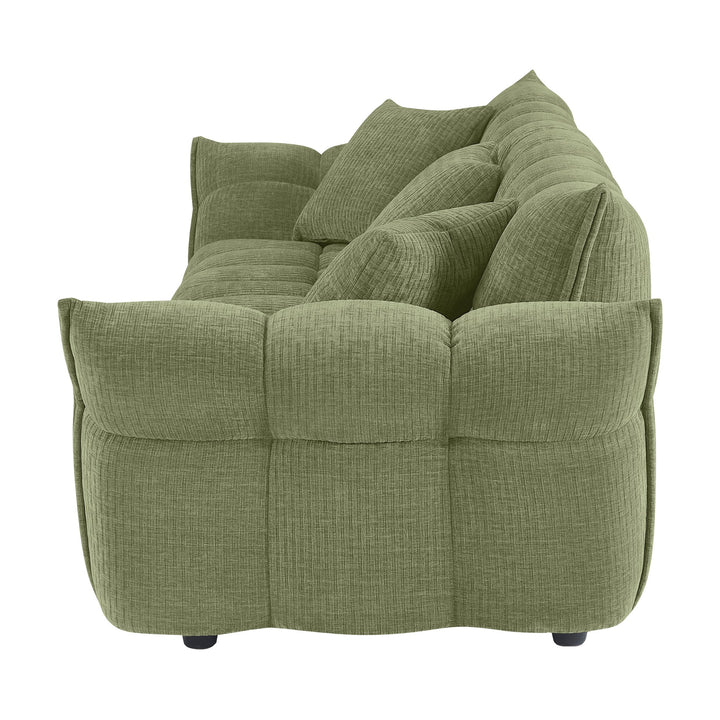 Marigold sofa i grønn kordfløyel, sidevisning med dype pløsede seksjoner