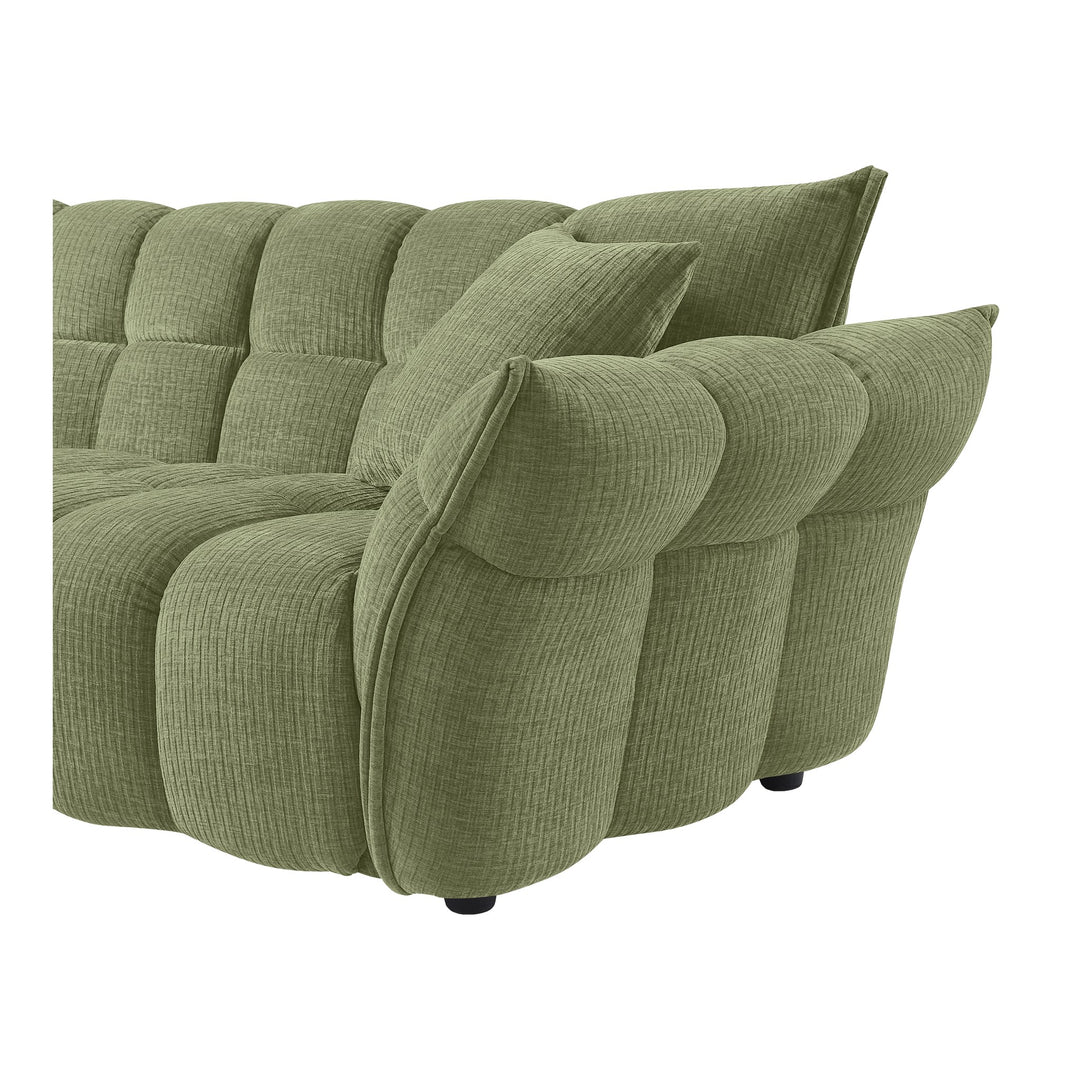 Marigold sofa i grønn kordfløyel, nærbilde av rullet armlene og pløset hjørne