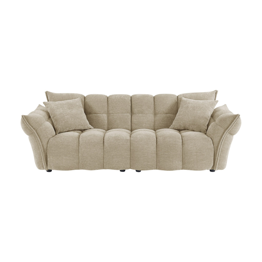 Marigold sofa i beige med puffet, ribbet chenillestoff og mørke ben