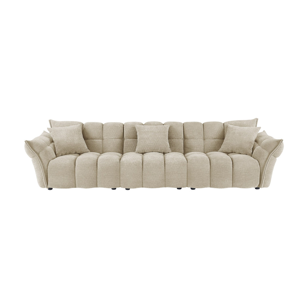 Marigold sofa i beige med puffet, ribbet chenillestoff og mørke ben