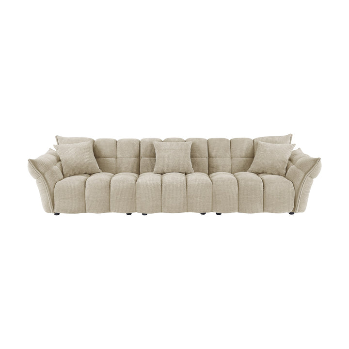 Marigold sofa i beige med puffet, ribbet chenillestoff og mørke ben
