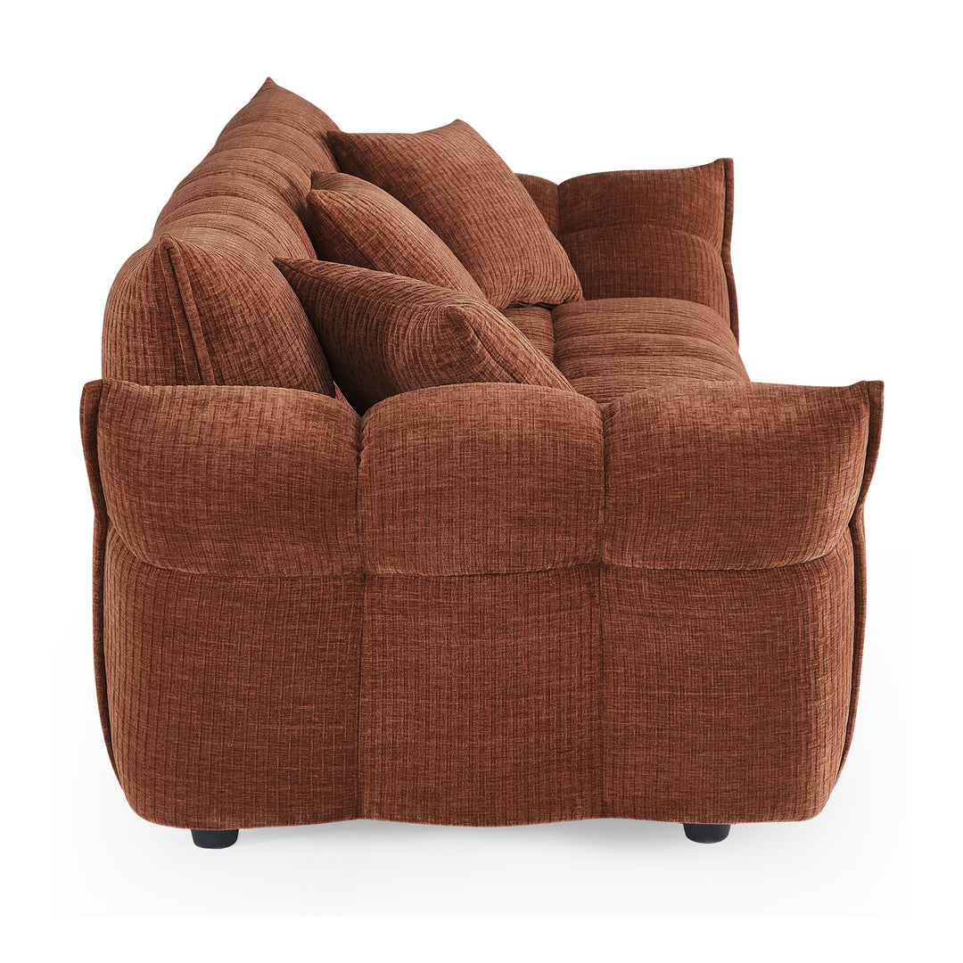 Marigold sofa i terrakotta kordfløyel, sidevisning av pløset rygg med høye armlener