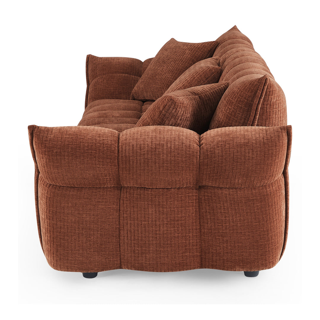 Marigold sofa i terrakotta kordfløyel, sidevisning med dype pløsede seksjoner