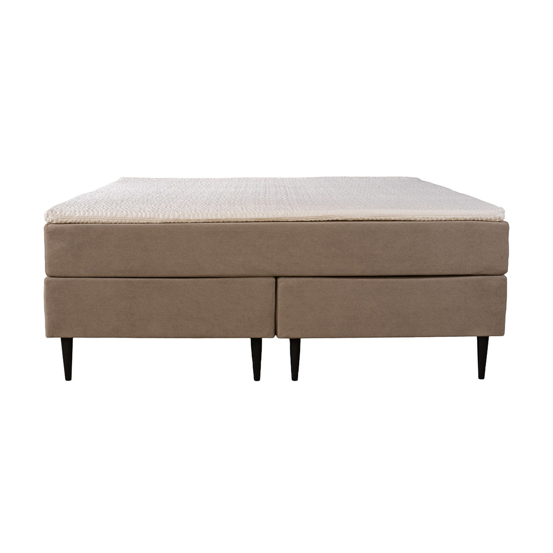 Asleep Venus kontinentalseng i beige, sett fra siden med hvit overmadrass og sorte ben