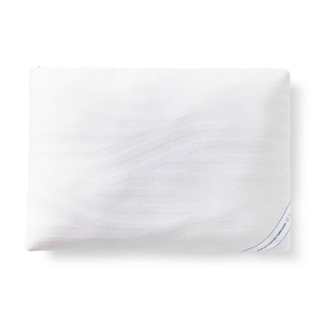 Tempur Comfort PureClean hodepute i hvitt med produktetikett, sett ovenfra mot hvit bakgrunn