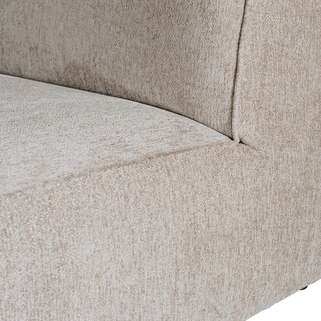 Como hjørnesofa, nærbilde av det gråbeige melerte chenillestoffet