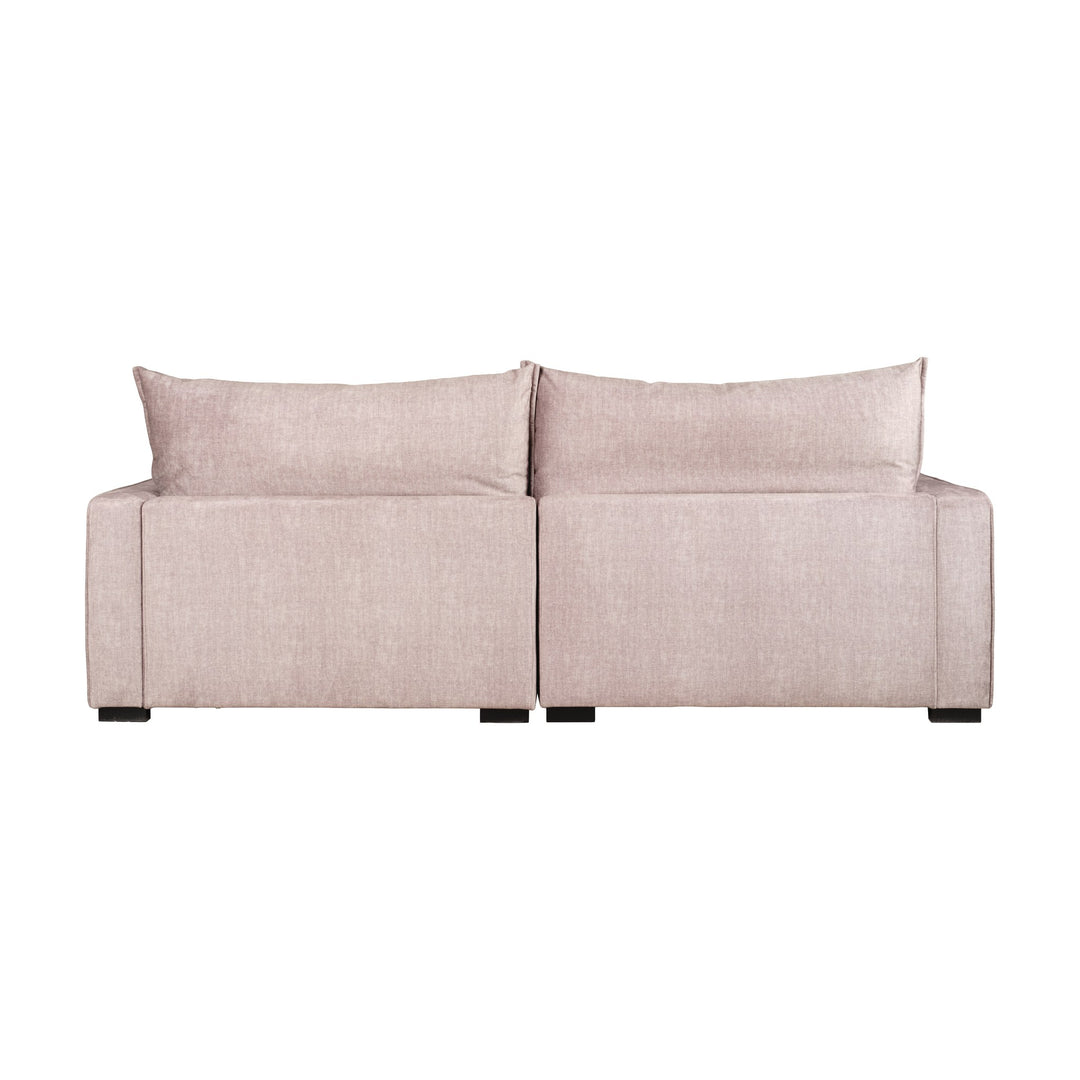 Rossi sofa i beige velur, sett bakfra mot hvit bakgrunn