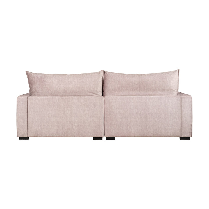 Rossi sofa i beige velur, sett bakfra mot hvit bakgrunn