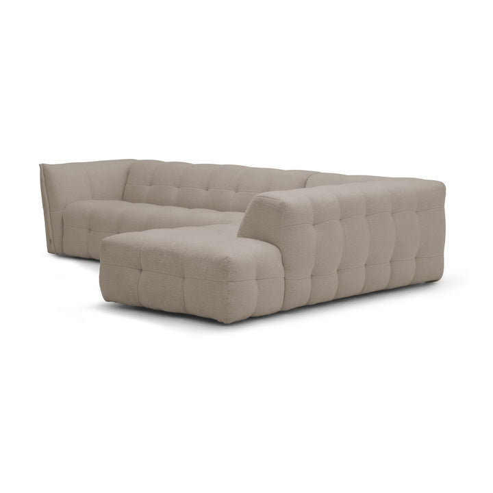 Bellus Moby modulsofa i greige bouclé med open end og puff, sett skrått bakfra