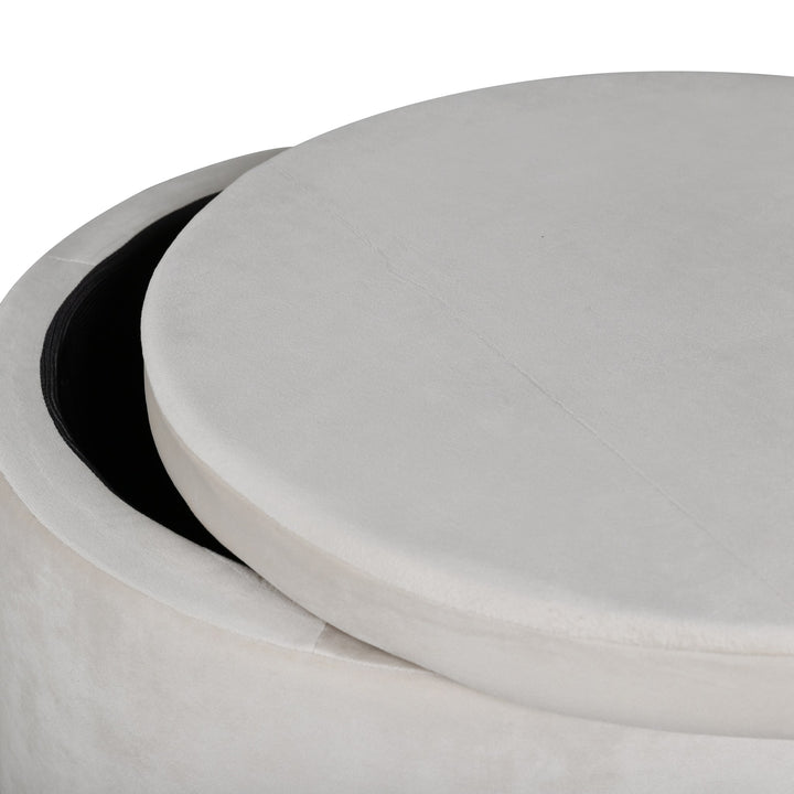 Dunken puff i beige fløyel med lokket løftet og svart innside, hvit bakgrunn