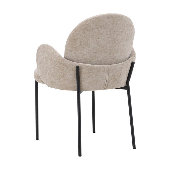 Blom spisestol i beige chenille med skulpturell rygg, sett skrått bakfra