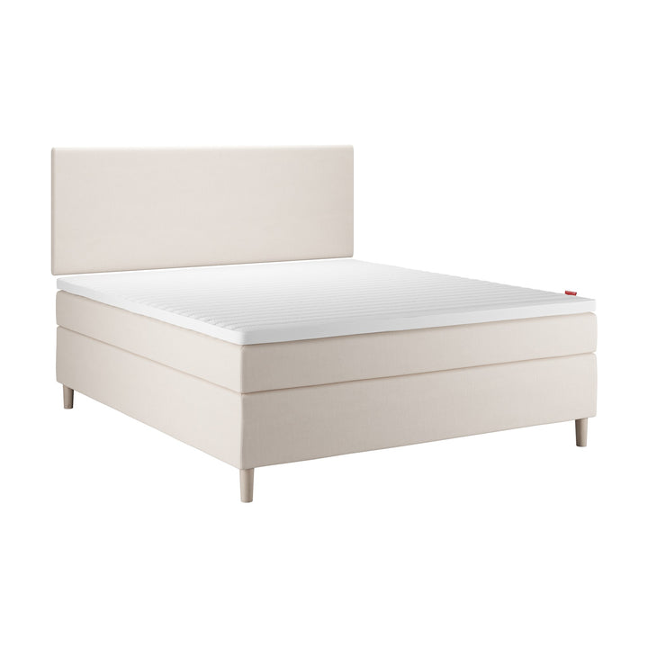 Wonderland Lento kontinentalseng i lys beige med polstret sengegavl, hvit bakgrunn